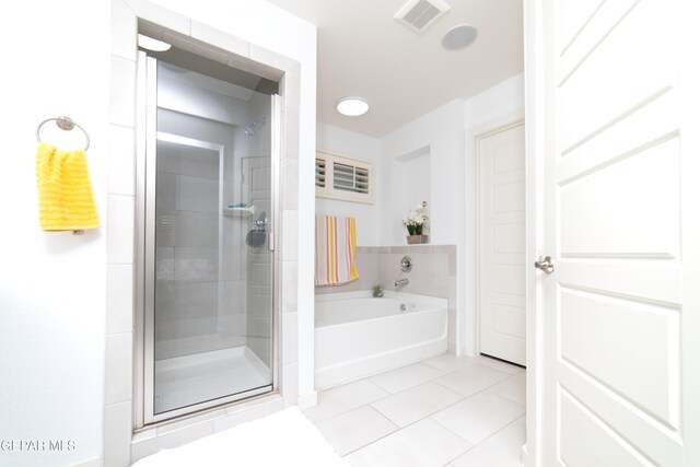 13673 Samlesbury Ave, Horizon City, TX 79928 - bathroom featuring tile patterned floors, a shower stall, and a bath
