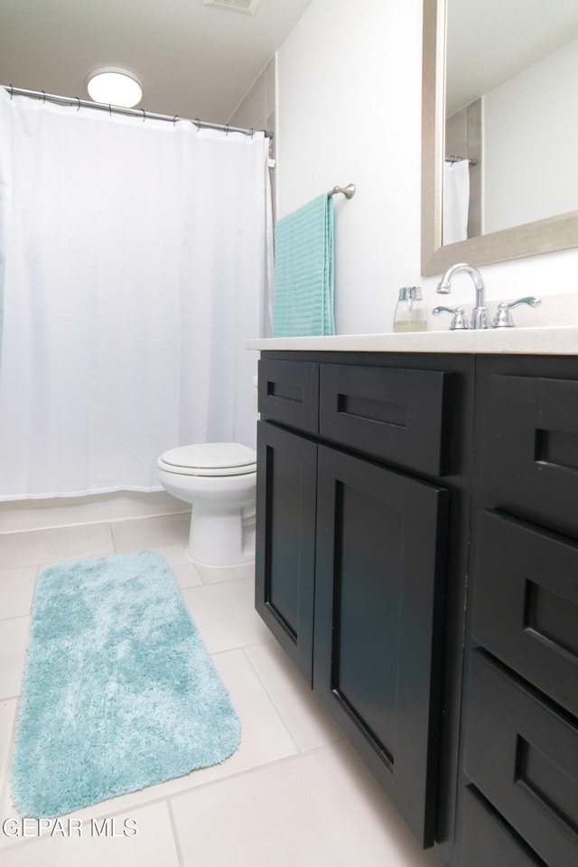 13673 Samlesbury Ave, Horizon City, TX 79928 - bathroom featuring vanity, toilet, tile patterned floors, and a shower with curtain