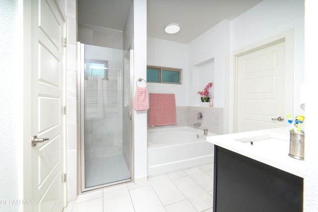 13673 Samlesbury Ave, Horizon City, TX 79928 - full bath with tile patterned flooring, a shower stall, a garden tub, and vanity