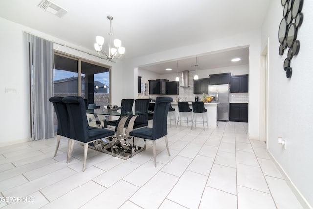 13673 Samlesbury Ave, Horizon City, TX 79928 - dining room with a chandelier and light tile patterned floors
