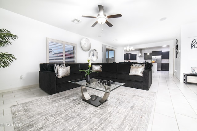 13673 Samlesbury Ave, Horizon City, TX 79928 - living room featuring a ceiling fan, a chandelier, and light tile patterned flooring