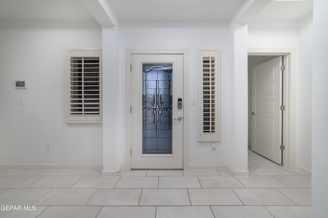 13673 Samlesbury Ave, Horizon City, TX 79928 - entryway with light tile patterned floors and baseboards