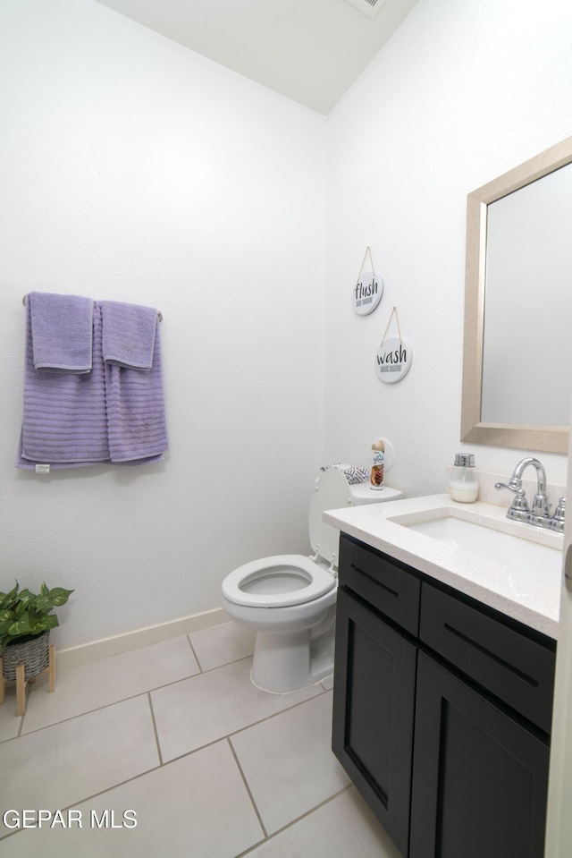 13673 Samlesbury Ave, Horizon City, TX 79928 - half bath with toilet, vanity, tile patterned flooring, and baseboards