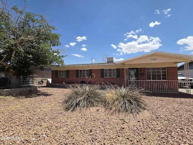 rear view of property featuring brick siding