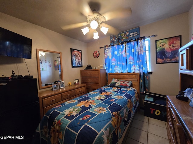 bedroom with light tile patterned floors and ceiling fan