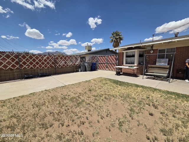 view of yard with a patio and fence