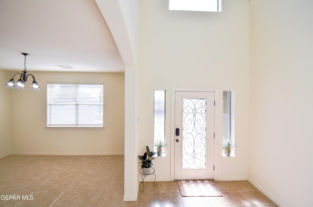 12093 Rathmore Dr, El Paso, TX 79928 - foyer with a chandelier, baseboards, and a towering ceiling