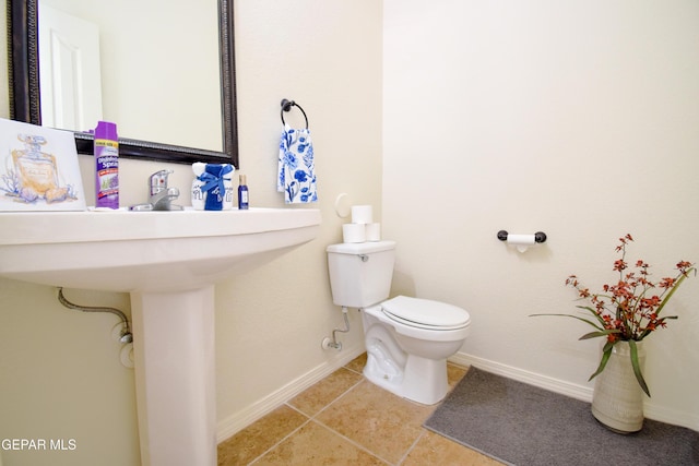 12093 Rathmore Dr, El Paso, TX 79928 - bathroom featuring toilet, tile patterned floors, and baseboards