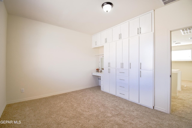 12093 Rathmore Dr, El Paso, TX 79928 - unfurnished bedroom with light carpet and baseboards