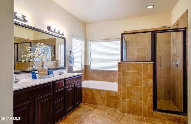 12093 Rathmore Dr, El Paso, TX 79928 - full bathroom with a stall shower, a bath, double vanity, and tile patterned floors