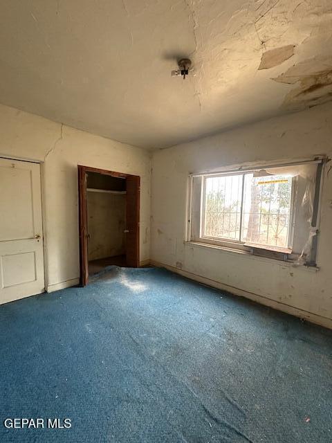 unfurnished bedroom featuring carpet flooring