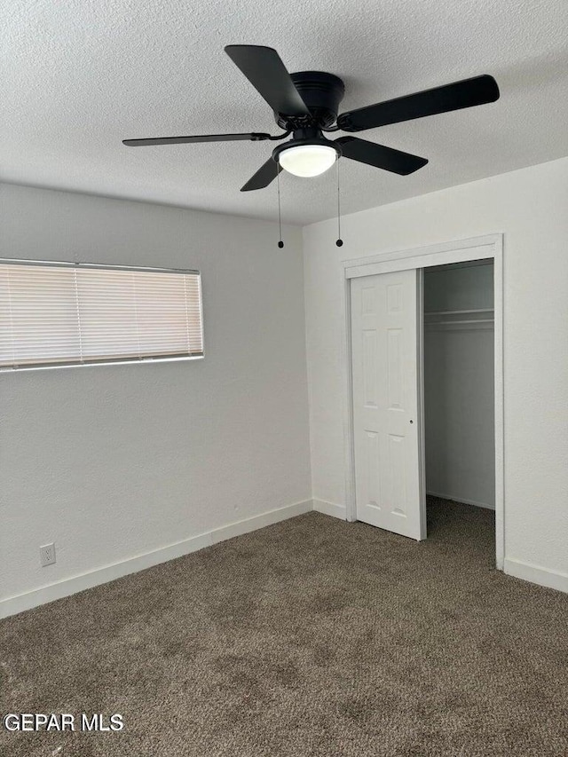 3512 Kemp Ave, El Paso, TX 79904 - unfurnished bedroom with carpet flooring, a closet, a ceiling fan, and a textured ceiling