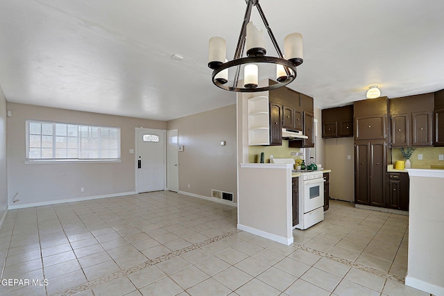 kitchen featuring white range with gas cooktop, light tile patterned floors, light countertops, dark brown cabinets, and under cabinet range hood