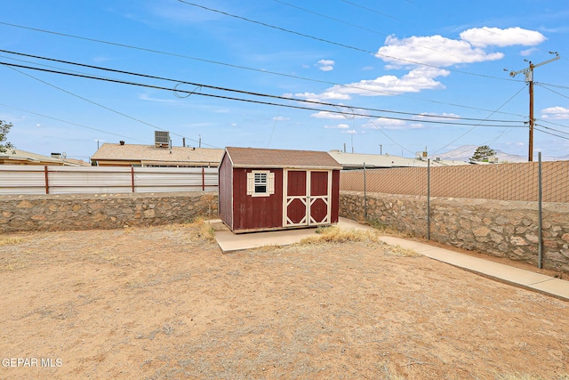 view of shed featuring a fenced backyard
