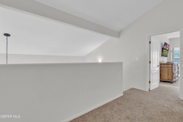 additional living space with vaulted ceiling, carpet, and baseboards