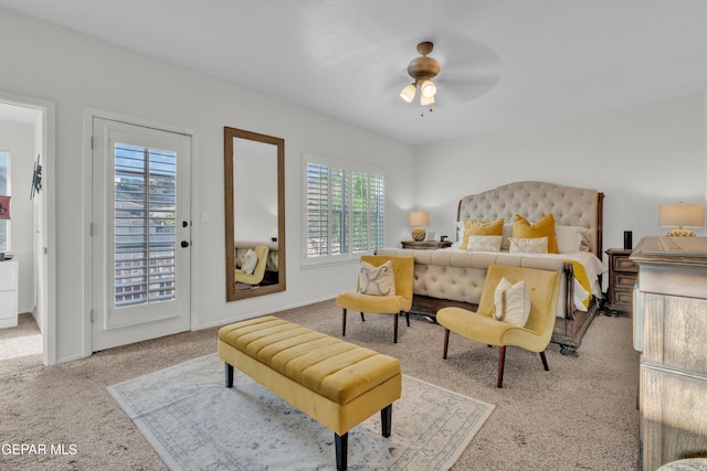 bedroom featuring carpet, access to exterior, and a ceiling fan