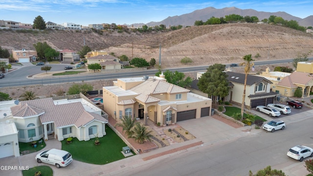 aerial perspective of suburban area with mountains