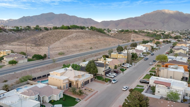 aerial view of residential area featuring mountains