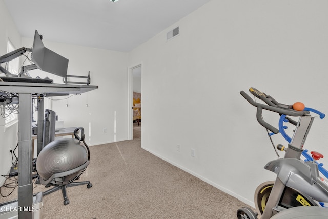 workout area with carpet and baseboards