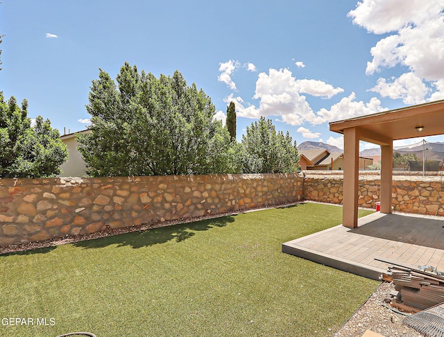 view of yard featuring a wooden deck