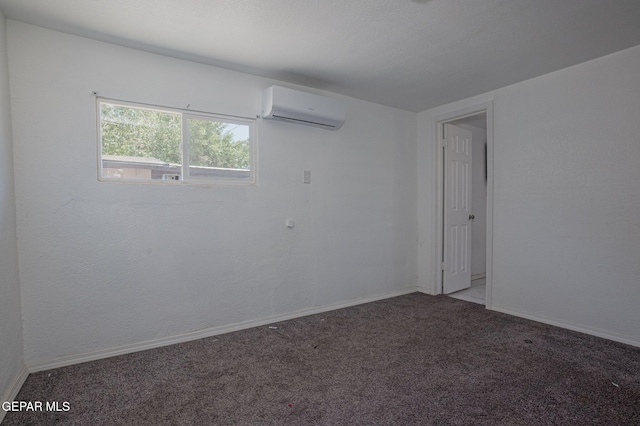 318 Austin St, Fabens, TX 79838 - empty room with an AC wall unit, carpet flooring, and baseboards