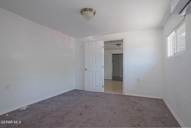 318 Austin St, Fabens, TX 79838 - carpeted empty room with a wall unit AC and baseboards