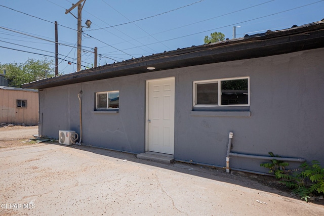 318 Austin St, Fabens, TX 79838 - back of property featuring stucco siding and a patio