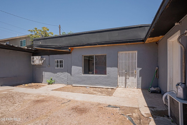 318 Austin St, Fabens, TX 79838 - rear view of property featuring ac unit and stucco siding
