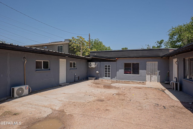 318 Austin St, Fabens, TX 79838 - back of house featuring ac unit and stucco siding