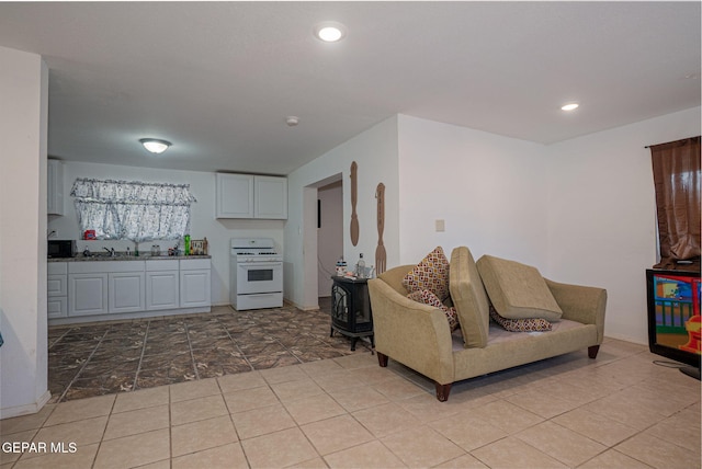 318 Austin St, Fabens, TX 79838 - living room with recessed lighting and light tile patterned flooring