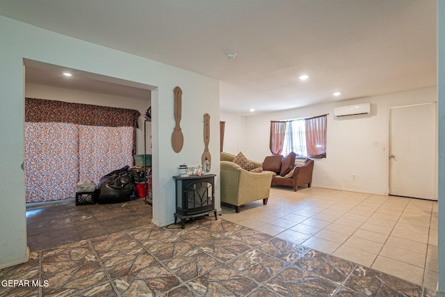 318 Austin St, Fabens, TX 79838 - living area with a wall unit AC, recessed lighting, and a wood stove