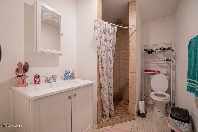 318 Austin St, Fabens, TX 79838 - bathroom with a shower stall, vanity, and toilet