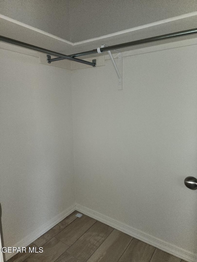 14508 Russell Borea, El Paso, TX 79938 - spacious closet featuring dark wood-type flooring