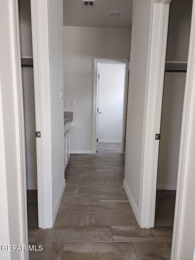14508 Russell Borea, El Paso, TX 79938 - hallway featuring wood finished floors and baseboards