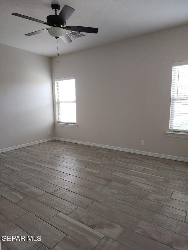 14508 Russell Borea, El Paso, TX 79938 - unfurnished room with wood finished floors, plenty of natural light, and a ceiling fan