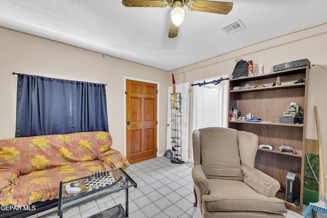 living area featuring a ceiling fan