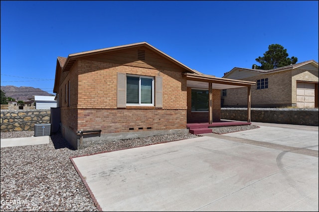single story home with brick siding and a patio area