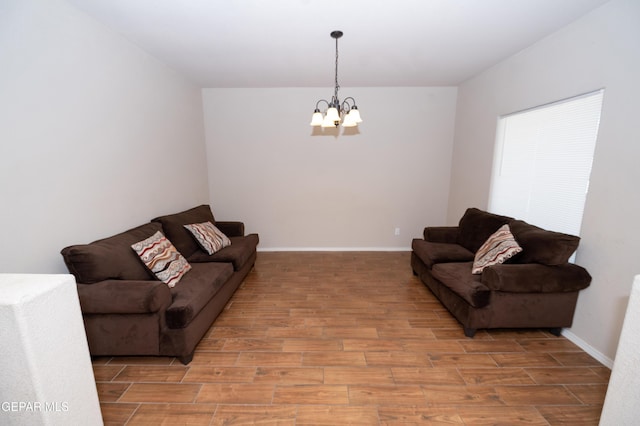804 Spofforth Rd, El Paso, TX 79928 - living room with a chandelier, wood finished floors, and baseboards