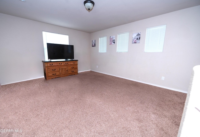 804 Spofforth Rd, El Paso, TX 79928 - unfurnished living room featuring carpet flooring and baseboards