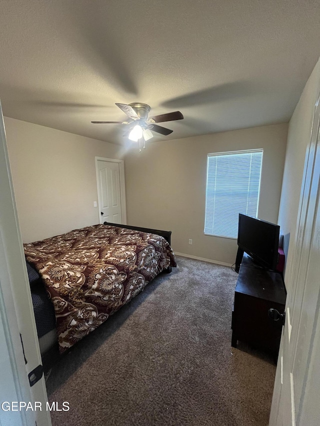 804 Spofforth Rd, El Paso, TX 79928 - carpeted bedroom featuring ceiling fan, a textured ceiling, and baseboards