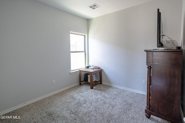 unfurnished bedroom with carpet floors and baseboards