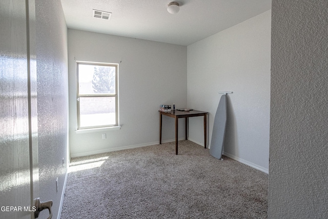 empty room featuring carpet