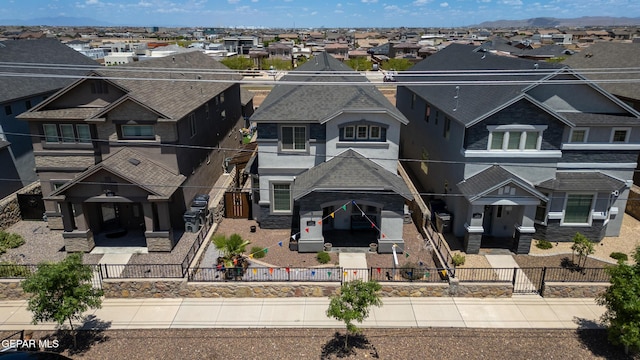14813 Pebble Hills Blvd, El Paso, TX 79938 - view of front facade with a residential view, a fenced front yard, and stucco siding
