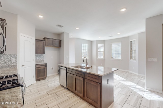 14813 Pebble Hills Blvd, El Paso, TX 79938 - kitchen with stainless steel appliances, a sink, decorative backsplash, an island with sink, and recessed lighting