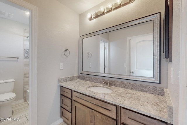 14813 Pebble Hills Blvd, El Paso, TX 79938 - bathroom featuring toilet, vanity, and baseboards