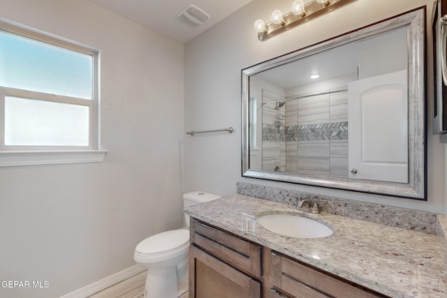 14813 Pebble Hills Blvd, El Paso, TX 79938 - bathroom featuring baseboards, toilet, vanity, and a tile shower