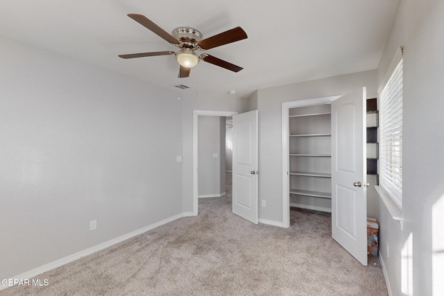 14813 Pebble Hills Blvd, El Paso, TX 79938 - unfurnished bedroom with carpet floors, a spacious closet, baseboards, a ceiling fan, and a closet