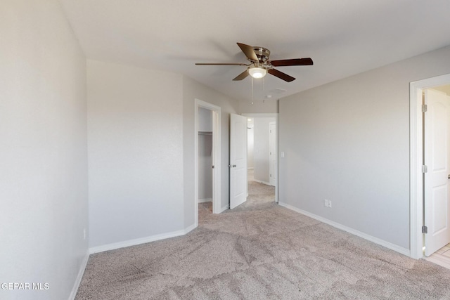 14813 Pebble Hills Blvd, El Paso, TX 79938 - unfurnished bedroom featuring light colored carpet, baseboards, ceiling fan, a walk in closet, and a closet