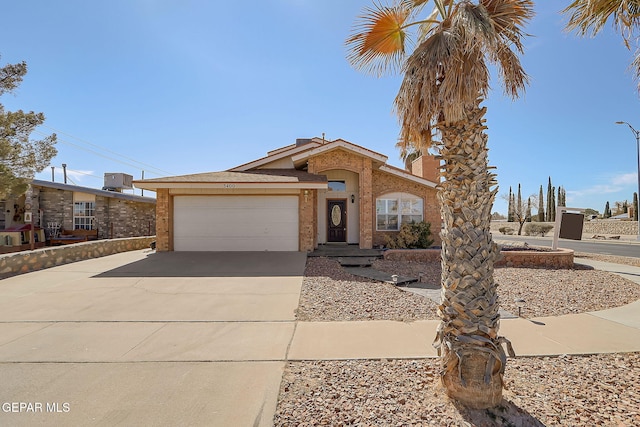 3400 Buffalo Soldier Cir, El Paso, TX 79936 - view of front of house with a garage, driveway, and stucco siding