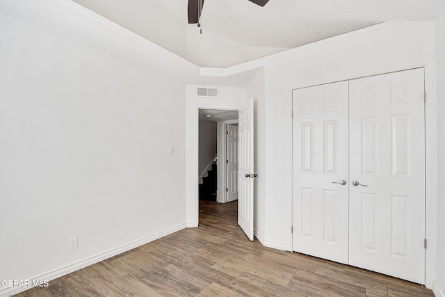 3400 Buffalo Soldier Cir, El Paso, TX 79936 - unfurnished bedroom featuring wood finished floors, baseboards, a closet, and ceiling fan